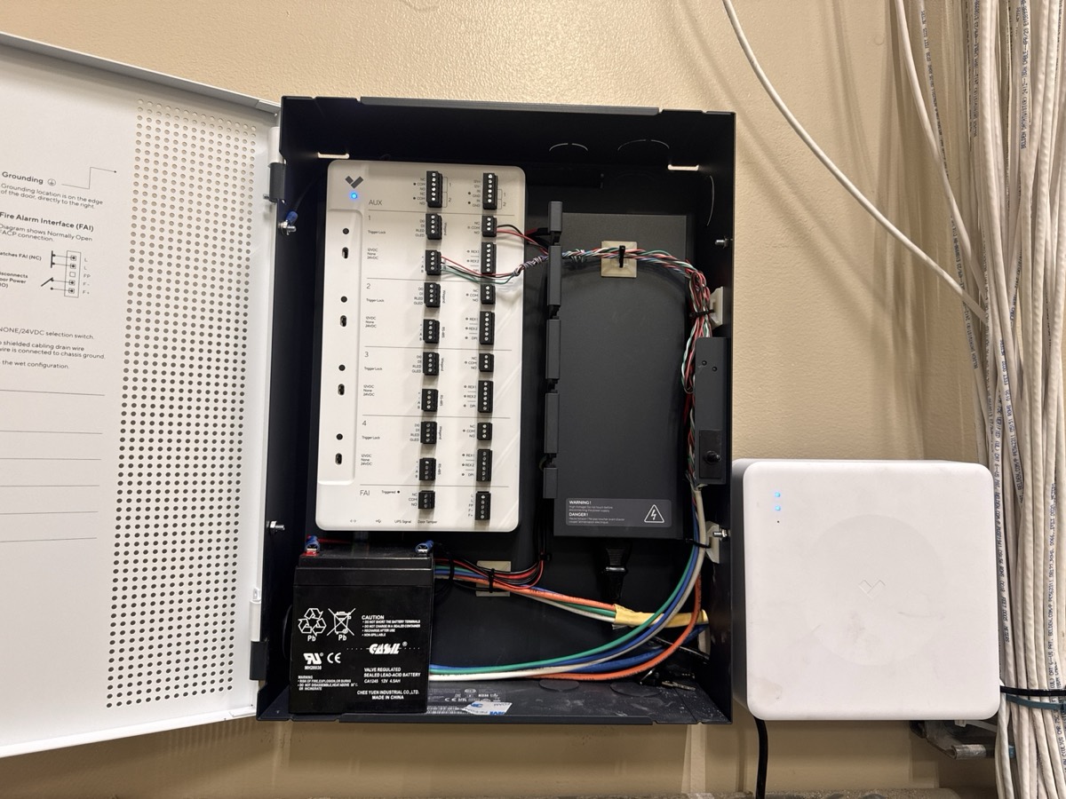An installed Verkada access control panel with organized wiring.
