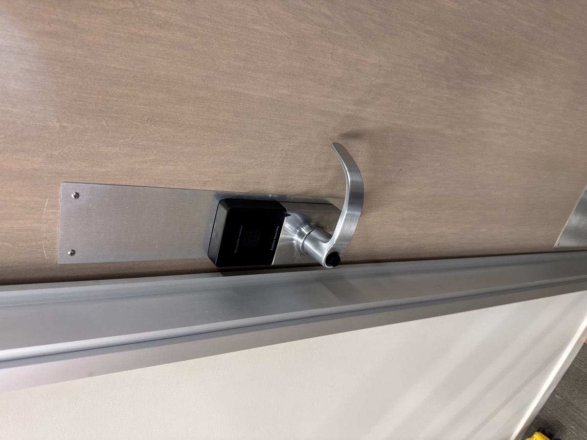 Close-up of a completed smart lock installed on an interior door at the Nampa facility.